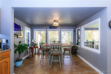 Additional breakfast nook with floor to ceiling windows on the back side