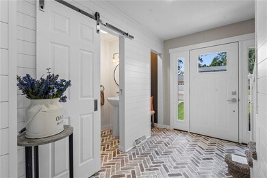 Custom brick inlaid floors, detailed Shiplap walls
