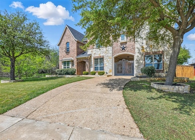 Angled front view showing driveway, port-cochere, 