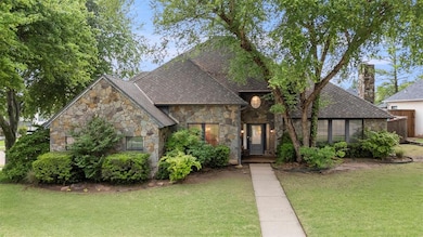 View of front of property featuring roof with shin