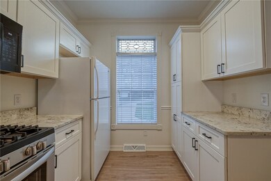 The kitchen window looks out front and allows sunl