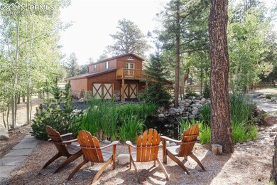 Stunning barn with horse stalls, plus the pond.