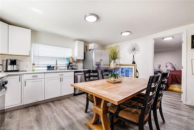 Dining area featuring light wood-style floors