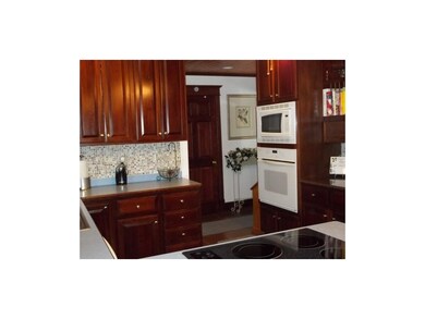 Enjoy the warmth of cherry woodwork & cabinetry