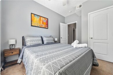 Bedroom with carpet and ceiling fan