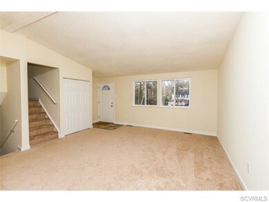 Main level den with new carpet and fresh paint.