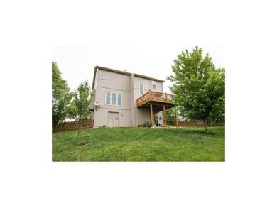 Rear View of Home with double doors into basement!