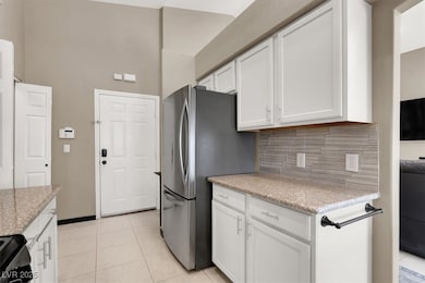 Kitchen featuring light tile patterned flooring, s
