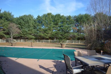This is a fall/winter view with the pool covered for the winter.