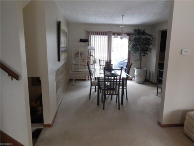 Dining Room with wall to wall carpeting.
