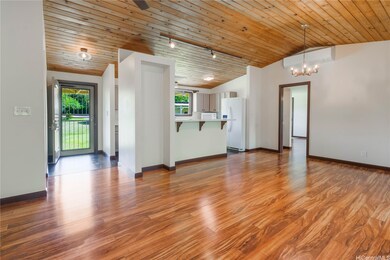 Front door leads to the kitchen and living area.