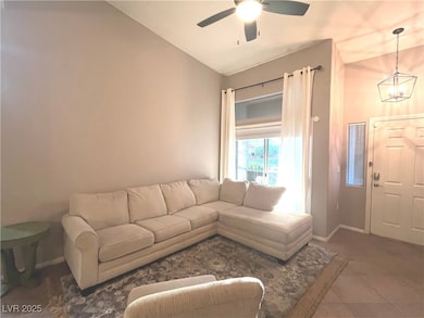 Family room with vaulted ceilings, ceiling fan & light that opens to the dining area and kitchen.