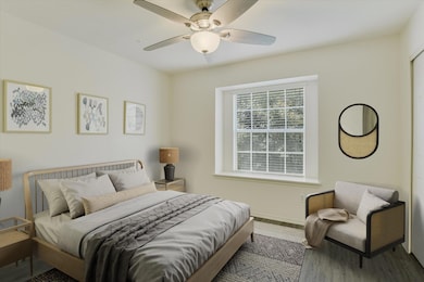 Bedroom with wood finished floors and ceiling fan