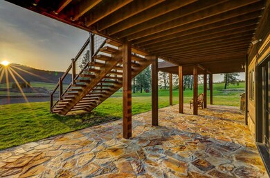 Lower patio and stairs leading to the upper Deck