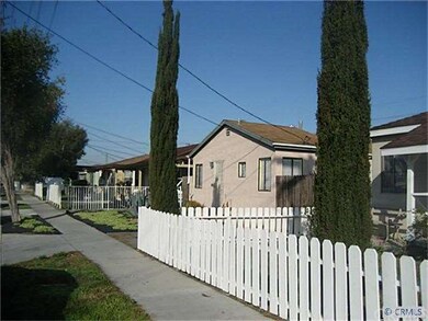 Trees and a white fence