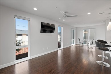Living room with dark hardwood / wood-style floori