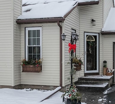 A welcoming front entrance with cedar window boxes