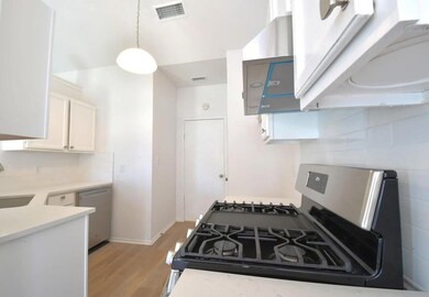 Kitchen featuring appliances with stainless steel