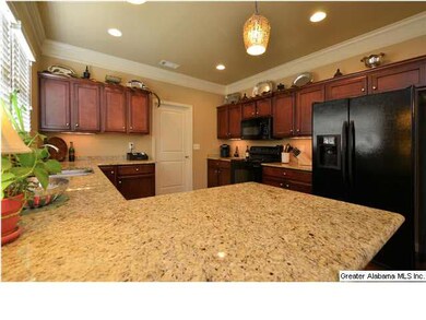 Upgraded Kitchen with granite countertops, pendant