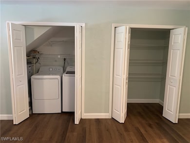 Laundry room with washer and clothes dryer and dar