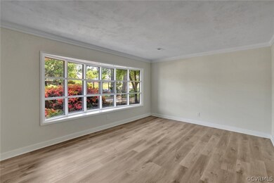 Living room with tons of light.  New floors throug