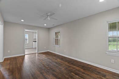 Spare room featuring a ceiling fan, recessed lighting, and wood finished floors