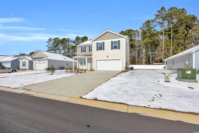 Front of property with a garage