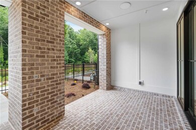 The covered patio offers an ideal space for finding shade or retreating from the rain.