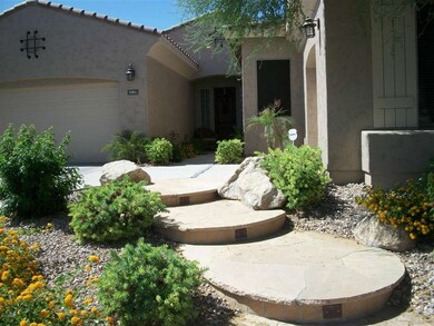 Flagstone walk-way & lovely landscaped!