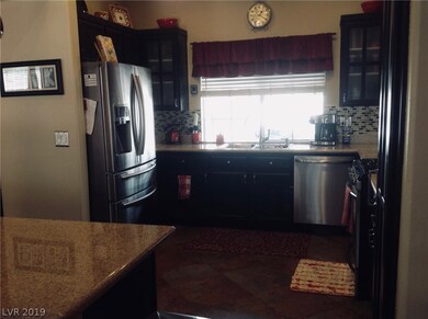 Kitchen has a Breakfast Bar, Granite Counters, Cus