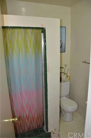 Bathroom and Stand up shower located near laundry 
