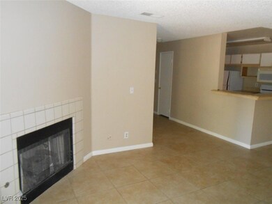Unfurnished living room featuring light tile patte