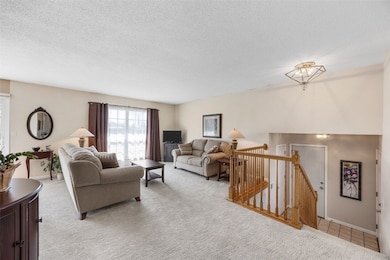 upper level living room is open to dining area and