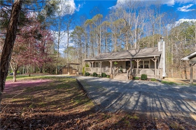 View of front of house featuring a chimney and a p