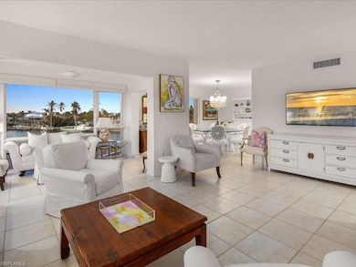 Living room with light tile patterned flooring and