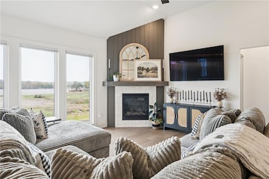 Living area with a gas fireplace and engineered hardwood floors