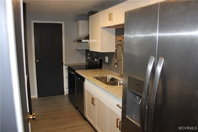 Kitchen with stainless steel fridge with ice dispe