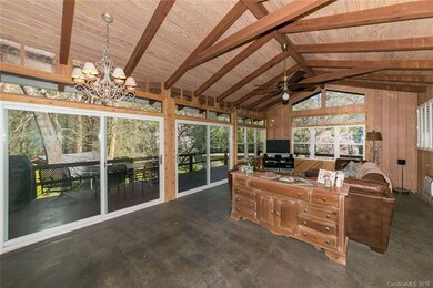 31x16 entertainment room with wet bar opens to deck and overlooks pond