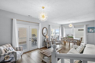 Living room featuring french doors, an inviting ch