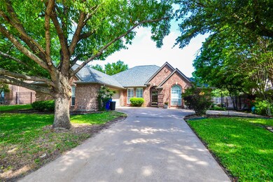 View of front of home with beautiful large trees