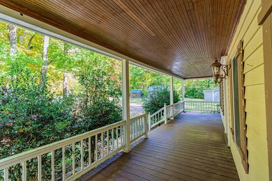 Front porch looks over front and side yards.
