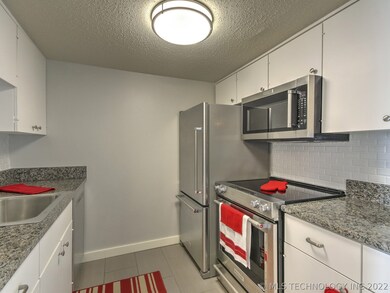 Kitchen provides ample countertops and lots of cab