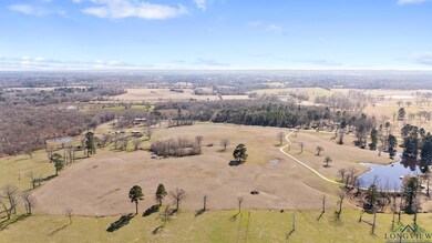 Aerial view featuring a water view and a rural vie