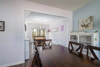 Dining room featuring ornamental molding, a textur