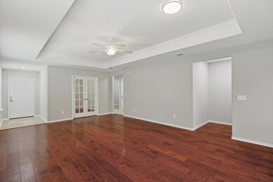 Living Room opens to Den-Office with French Doors 