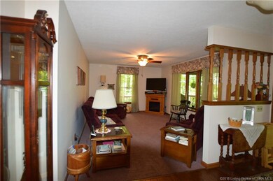 Large living room with bay window, carpet and ceil