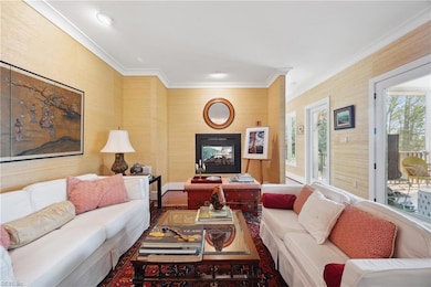 Living room has two way fireplace opening to breakfast/sitting room