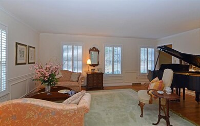 Just off the entry, the formal living room provide