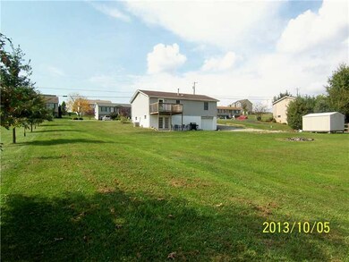 Exterior Back. LARGE FLAT LOT
