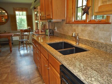 Shiny granite counter, tiled...